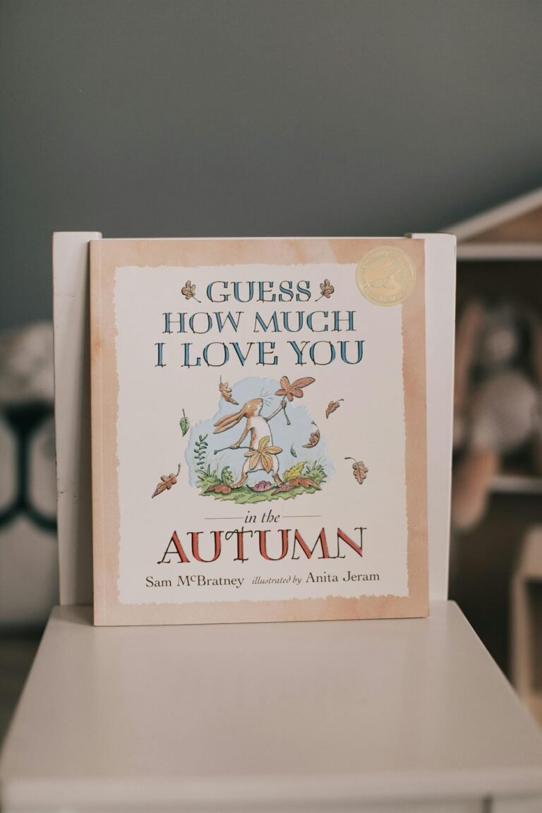 Cover of a children's book 'Guess How Much I Love You' with autumn illustrations.
